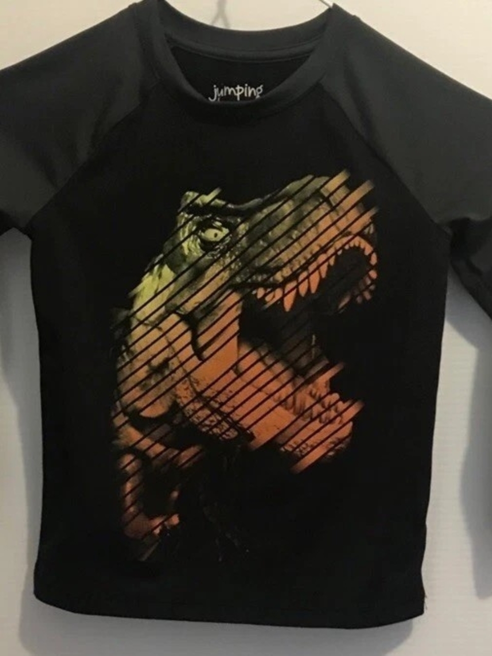 Ping Black Tee with Orange & Green Dino Graphic